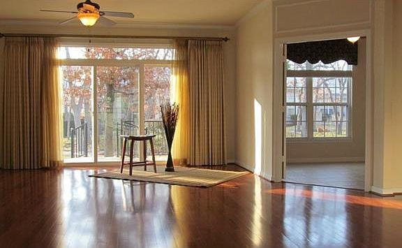 Sunny Great Room/ Custom Drapes and Window Treatments.Sellers states approx. $10,000 in custom window treatments through out this special home.
