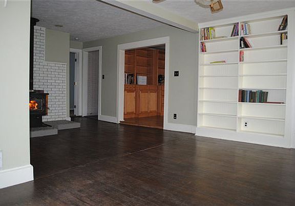 Sunroom with built in bookshelves