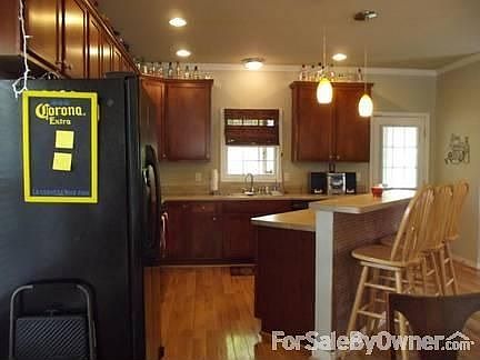 Kitchen
						:
						Recessed lights throughout the first floor with pendant lights over kitchen bar.
