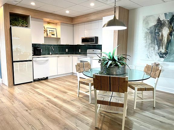 Everything in the kitchen is new - dishwasher, refrigerator, microwave, range.