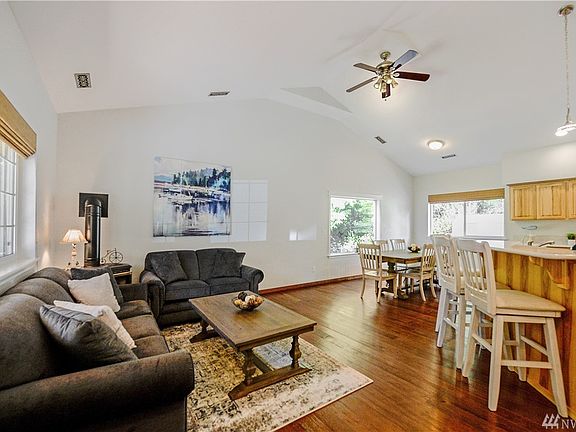 Vaulted ceilings and hardwoods throughout make this open living area extra spacious.
