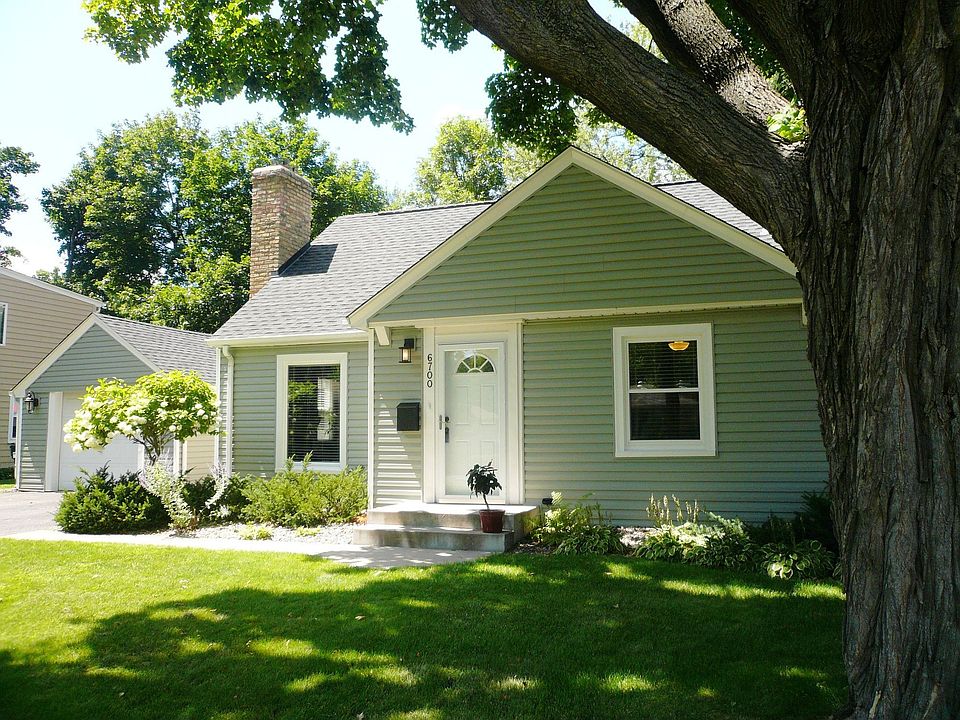 Gorgeous corner landscaped lot. Steps to park. New siding, roof & AC