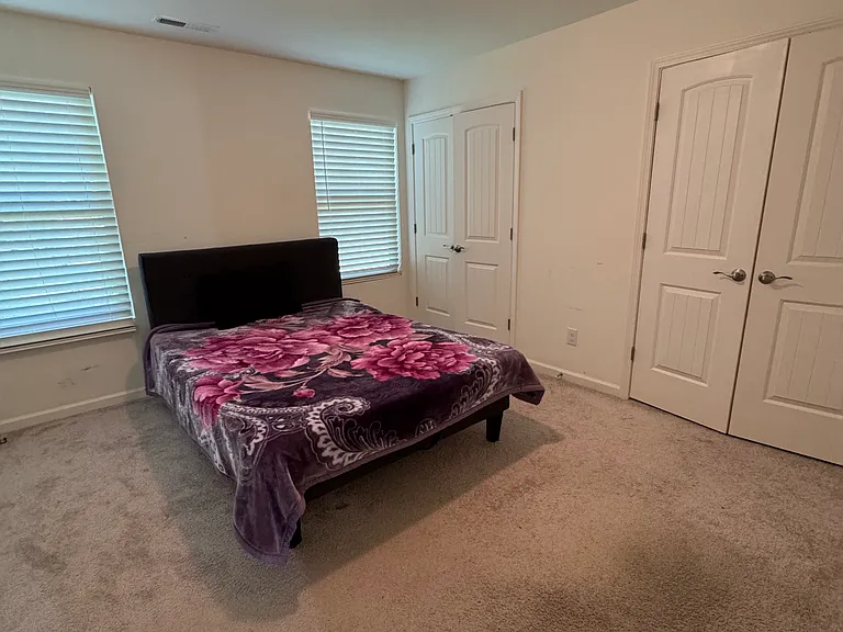 Master bedroom with two closets