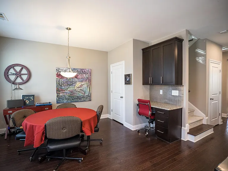 Very large open floor plan breakfast nook with built in desk