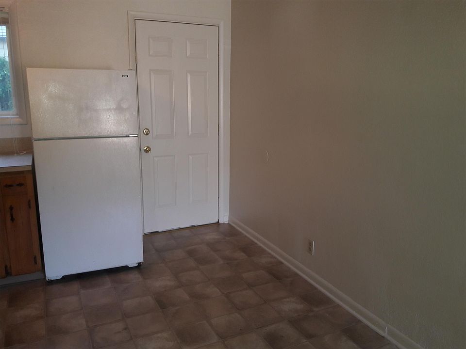 Dining room w/ door going to small back yard