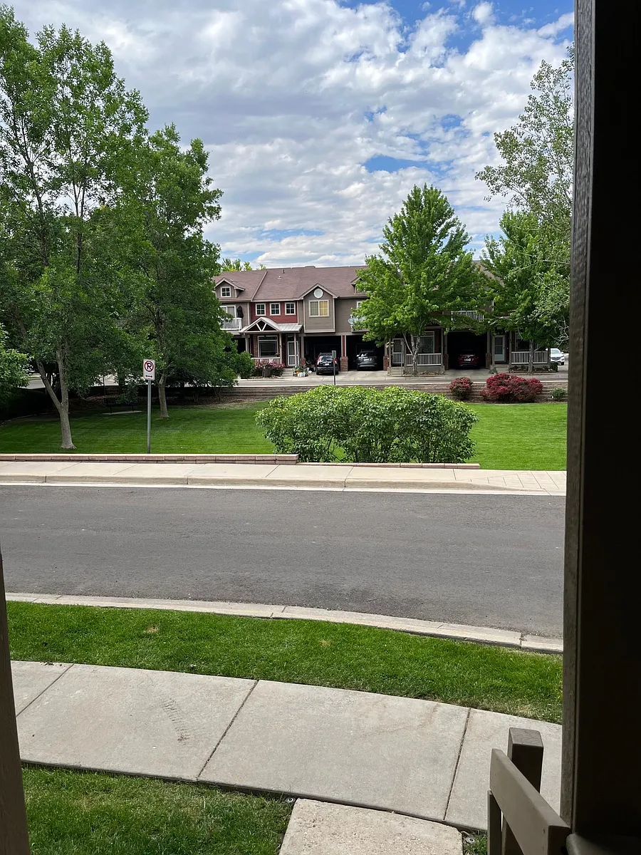 Photo 2 of 32 - 818 S Terry St #I8 - Longmont, CO You're steps away from a neighborhood park, and sidewalks make for lovely daily stroll while enjoying the beautiful Colorado weather. Perfect for dog lovers! - 818 S Terry St #I8