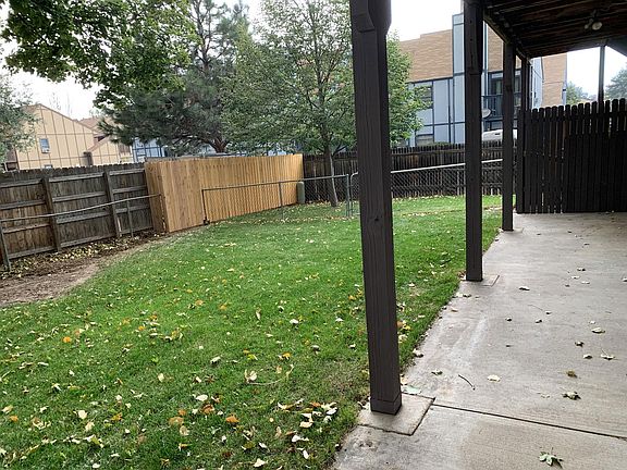 Covered patio and backyard.