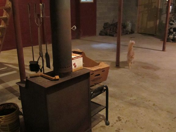 Unfinish. basmnt/wood stove