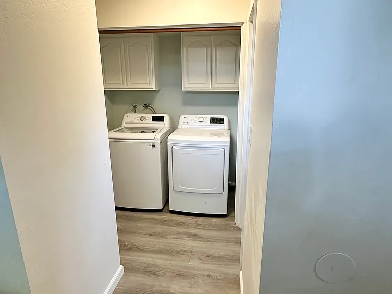 Hallway to laundry and half bath
