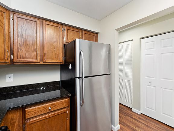 Granite countertops and adjacent pantry closet