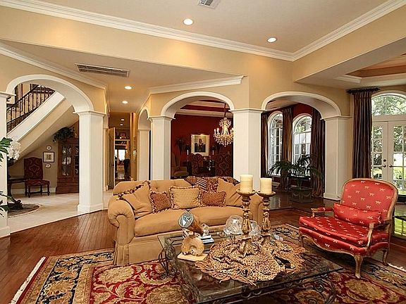  Anchored by the living room, the open floor plan brings together the piano area, grand foyer, and dining room