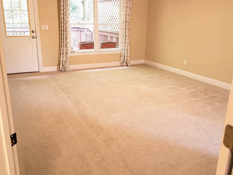 Huge master bedroom overlooking backyard deck and greenspace. Has remote controlled fan with light dimming.