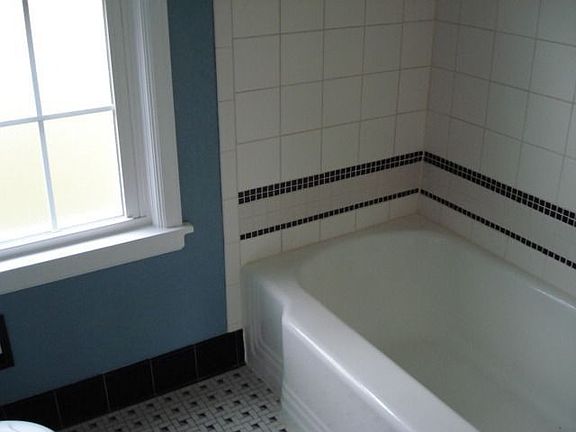 Tub to ceiling ceramic tile