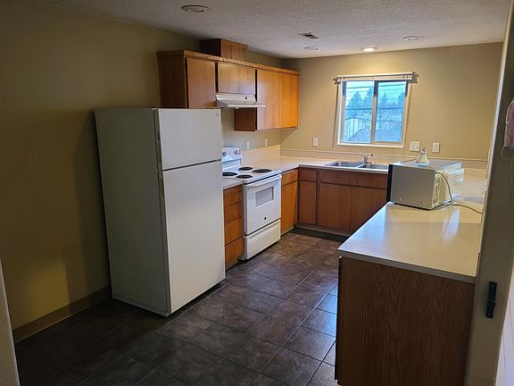 Kitchen has Frig, Range, Dishwasher, garbage disposal