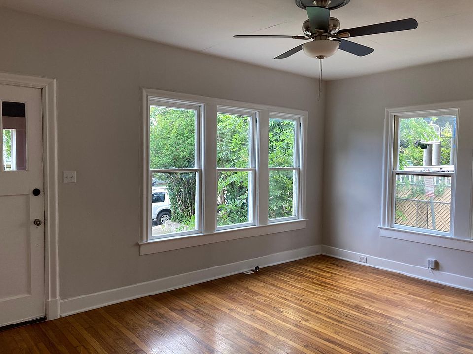 Beautiful hardwood floors and tall windows signal the era in this 1921 home as you enter the living room.