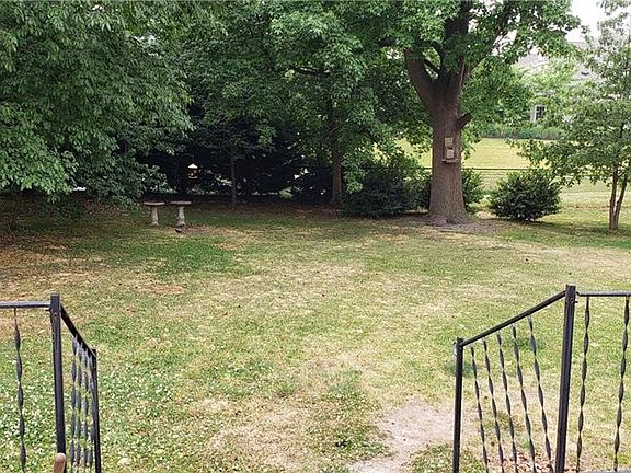 View from your back brick deck overlooking the large fenced backyard.  Great space for dogs and children.  Don't have a dog?  The local shelters are full of wonderful pets needing homes!