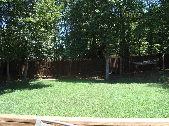 Fenced in backyard provides safe play area for kids or pets!