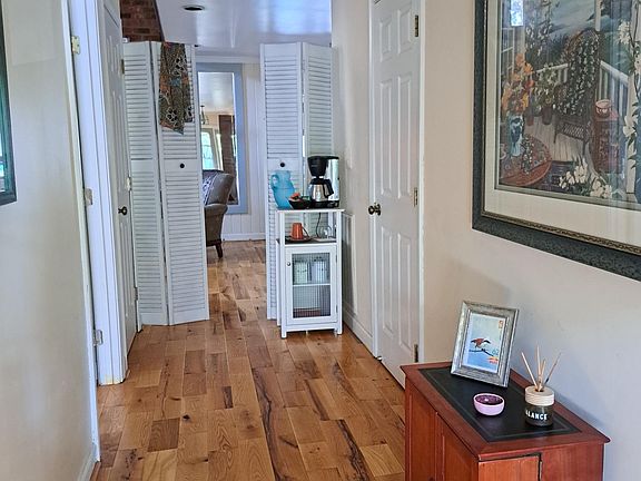 Front entrance hall. Bedroom is door on left and bathroom is door on right. Walk straight through to dinette on right, living room on left and sun porch straight ahead.