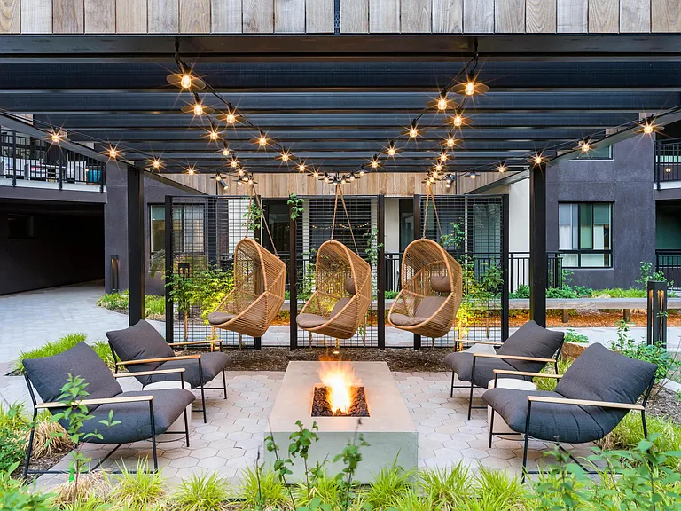 Sink into the unique comfort of our hanging lounge chairs, surrounded by vibrant greenery.