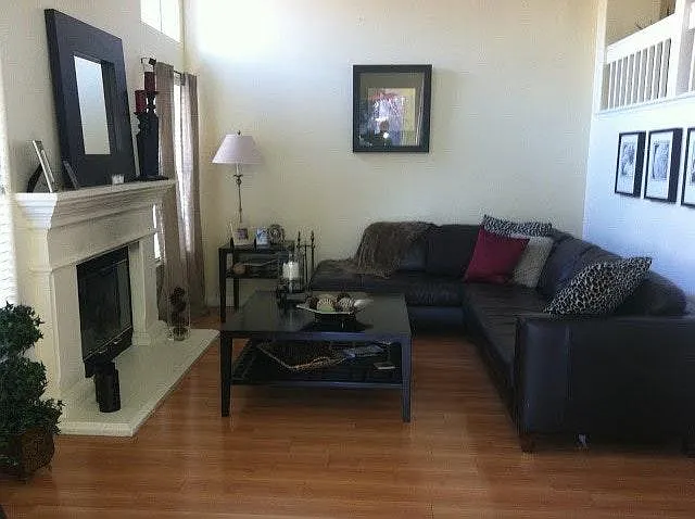 Spacious Living Room with high ceiling and fire place