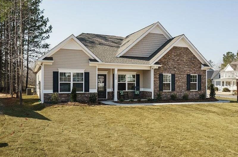 This Avery exterior offers cement siding with stone or brick accents available. aluminum gutters on