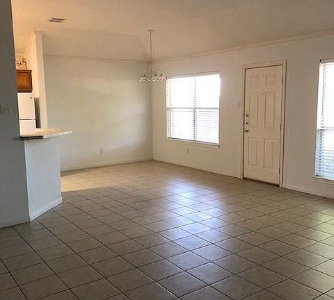 Tiled living room, dining room & kitchen area