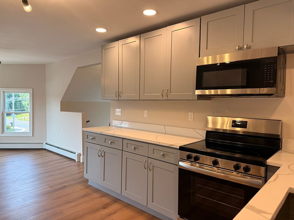 KITCHEN - all brand new appliances, fixtures and finishes, windows. Huge kitchen with lots of cabinet/storage space, quartz countertops and wonderful lighting.