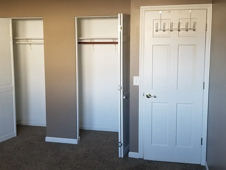 Master bedroom features two closets with bifold doors, led lighting, shelves and hanging rods, door hooks on back of door to the hall.