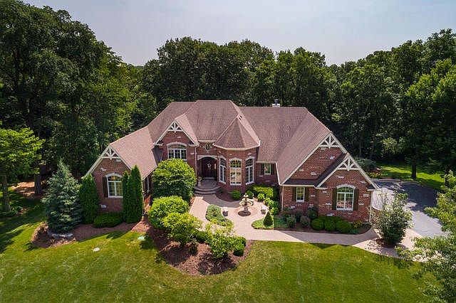 Prepare to be amazed by this stunning ranch which sits on 1 acre of land with a backdrop of woods, a