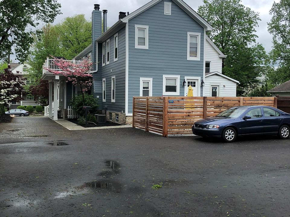 Back of building showing new fenced-in private concrete patio