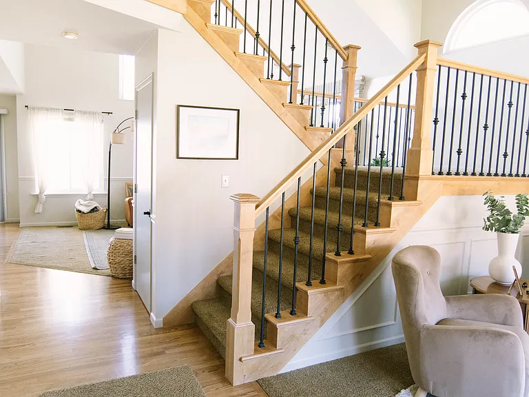 view from front door - sitting room to the right, dining room to the left, and straight ahead to kitchen and living room