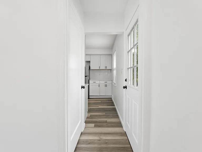 Hall to lower level, side entry door and kitchen