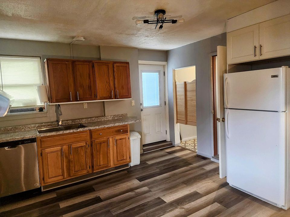 New back door, dishwasher, sink, countertops, flooring lighting