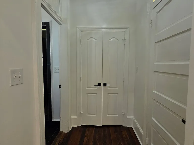 Hallway to pantry, laundry, and bathroom
