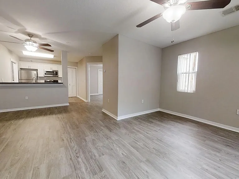 The Chateau floor plan offers generous living space, ceiling fans, and a stylish kitchen with stainless steel appliances.