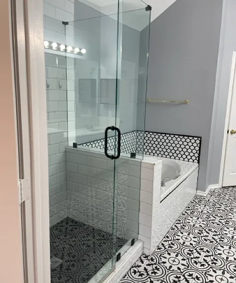 Walk in Shower w/glass door and soaking tub adjacent.