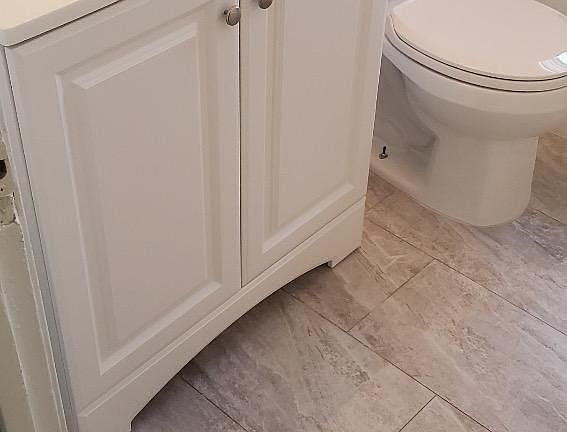 New vanity, new flooring makes the bathroom modern and clean