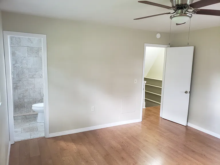 Master bedroom with remodeled bath