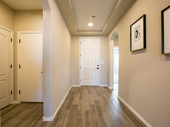 Enjoy a quaint entryway enhanced with an accented tray ceiling.