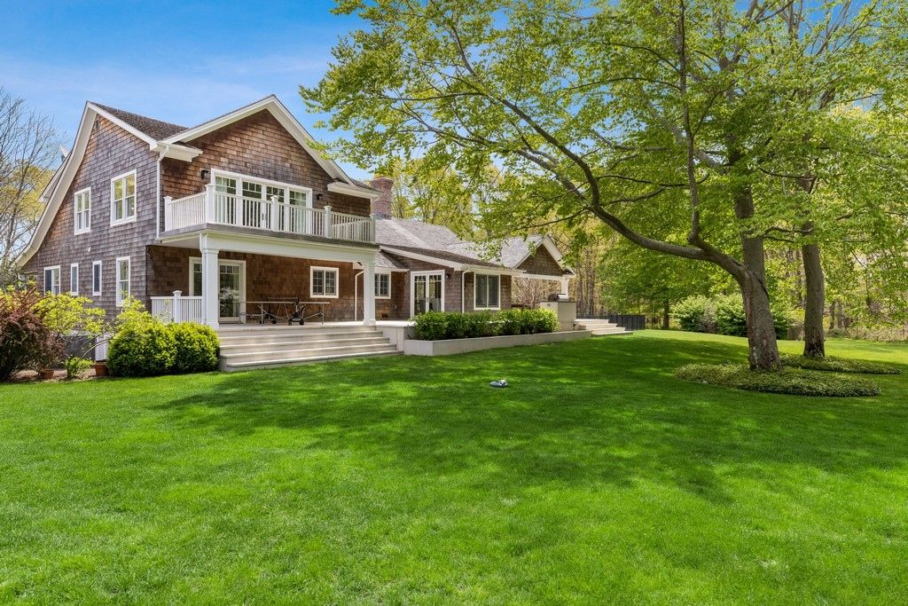 Covered porch & deck off primary bedroom perfect for watching sunsets.