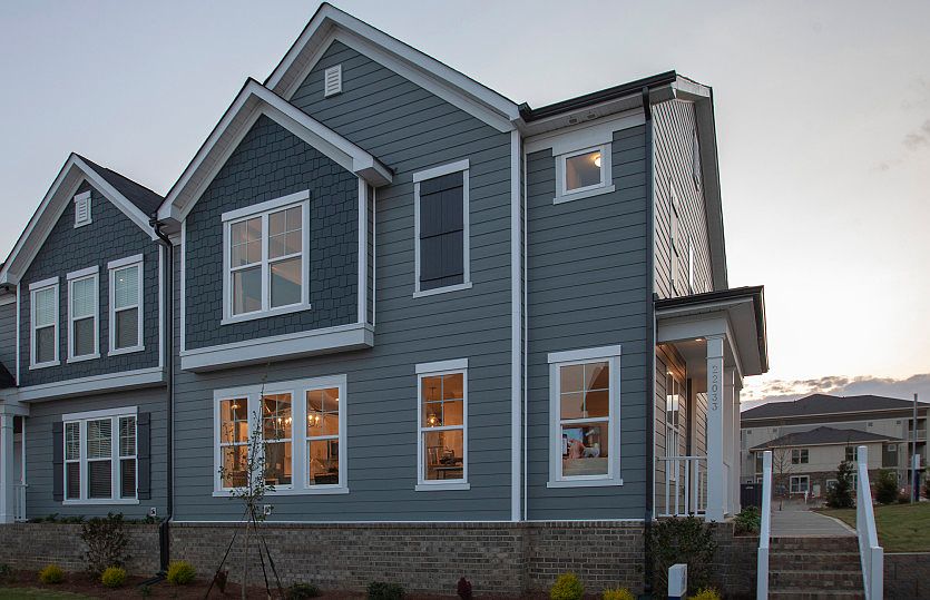 Sharon Exterior 21B features siding, shakes, covered front door and 2-car rear load garage