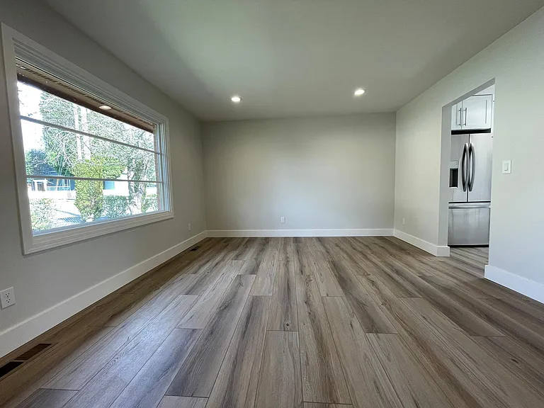 Unit 413 has refinished hardwood flooring rather than LVT like this unit 417