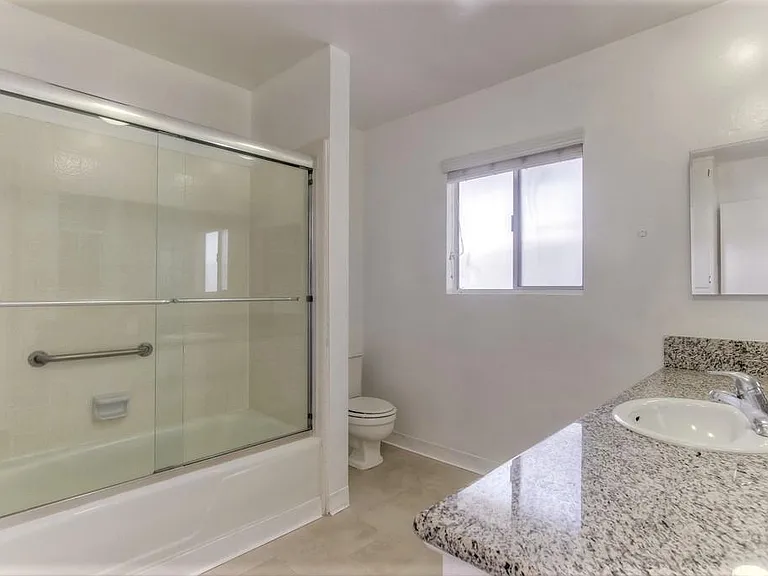 Bathroom with window and bathtub. 

*Images are of model unit-actual listing may differ slightly*