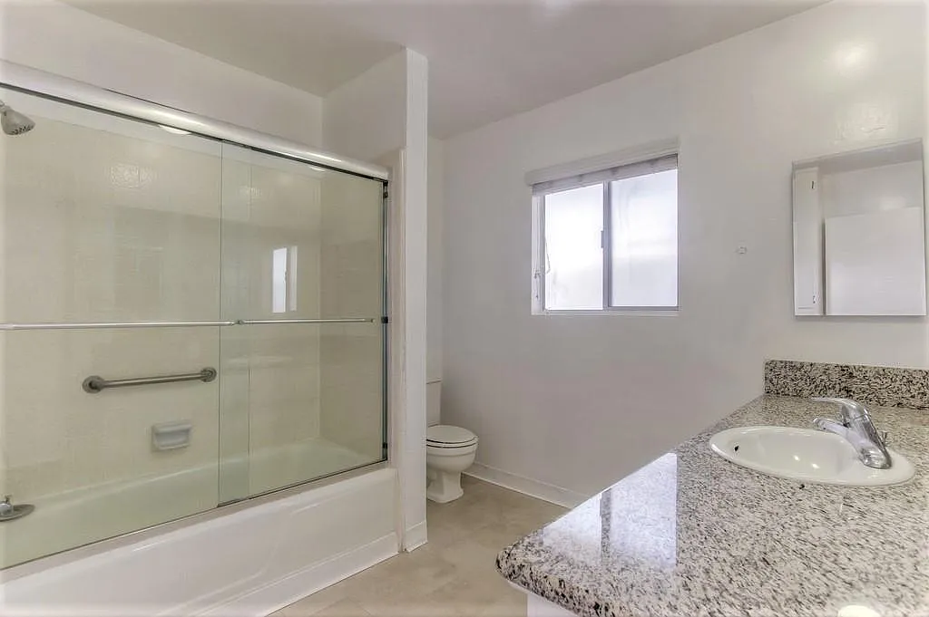 Bathroom with window and bathtub. 

*Images are of model unit-actual listing may differ slightly* - 120 S. Swall Drive