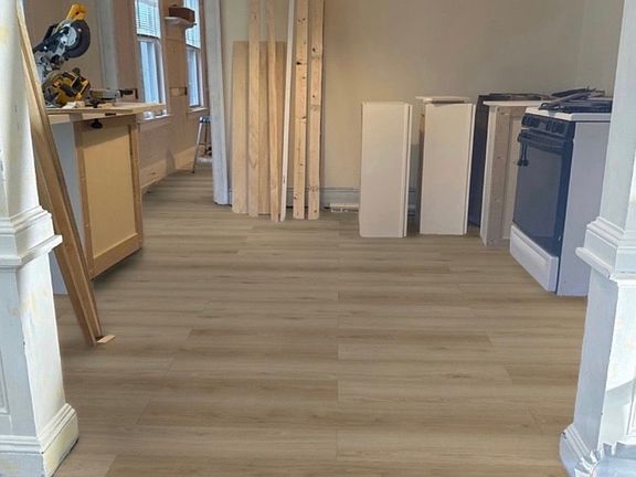 living room under rehab NEW FLOORING