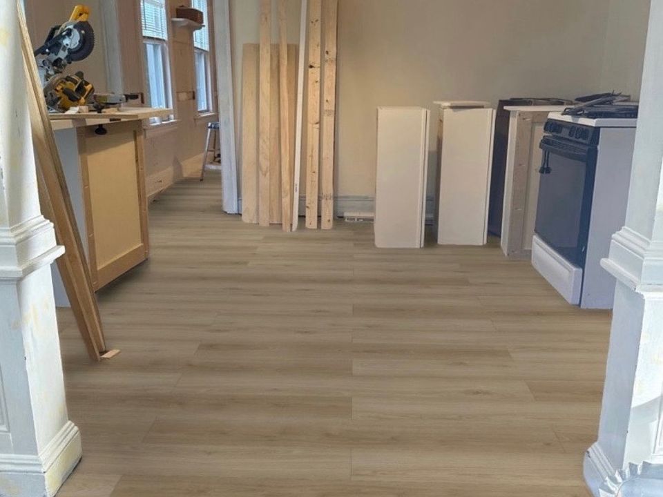 living room under rehab NEW FLOORING