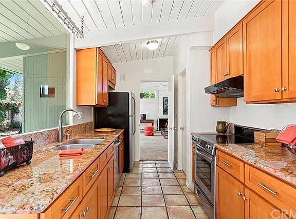 Recently remodeled kitchen with granite counters and stainless steel appliances.