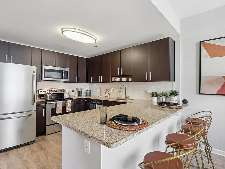 a kitchen with stainless steel appliances and a granite counter top