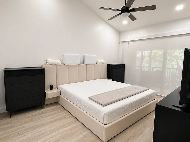 Master Bedroom - 17ft ceiling, King bed, balcony sliding door access and a LOT of space!