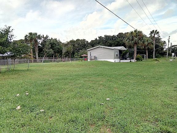 Beautiful grass and a very large front yard and fenced backyard